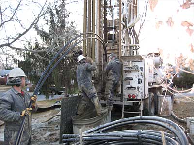 Protecting hearing while guiding the geothermal vertical loop tubing into the well.